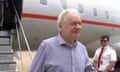 Julian Assange emerging from a plane