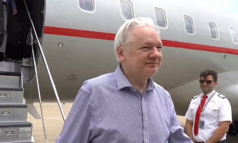 Julian Assange emerging from a plane