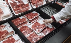 A worker restocks beef at a supermarket in Paramus, New Jersey in the US.