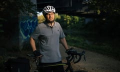 Phil Goldberg poses for a portrait with his bicycle.