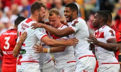 England celebrate after a try in the semi-final against Tonga