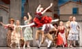 Marianela Nuñez in mid-air, doing the splits with arms thrown back above her head