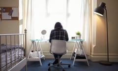 Female Student Sitting At Desk And Working In Bedroom<br>FWWC3W Female Student Sitting At Desk And Working In Bedroom