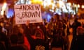 A demonstrator holds a sign with Andrew Brown’s name on it as protesters march in Elizabeth City, North Carolina, on 26 April. 
