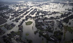 2017 AP YEAR END PHOTOS - Floodwaters from Tropical Storm Harvey surround homes in Port Arthur, Texas, on Aug. 31, 2017. The storm, which later became a hurricane, dumped record rainfall throughout the Houston area. (AP Photo/Gerald Herbert)