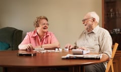 Older couple playing dominoes