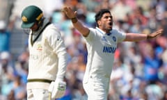 India's Umesh Yadav celebrates after taking the wicket of Australia's Usman Khawaja on the third day of the  World Test Championship final between India and Australia at The Oval.