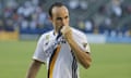 Landon Donovan kisses the badge on his return to LA Galaxy