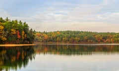 Walden Pond sunrise during fall with autumn color tress and pond reflection<br>GHN1FM Walden Pond sunrise during fall with autumn color tress and pond reflection