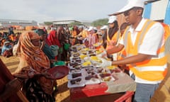 Local NGO workers serve Iftar food in a camp for internally displaced people in Mogadishu, Somalia. This year, Ramadan coincides with the longest drought on record in Somalia.