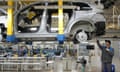 An electric SUV being assembled at a car plant in China