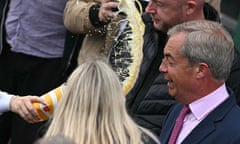 Nigel Farage reacts as he is about to be hit in the face with the contents of a drinks cup, during his general election campaign launch in Clacton-on-Sea