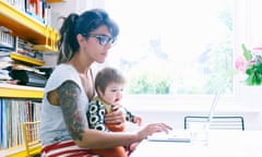 Woman working with child on her lap