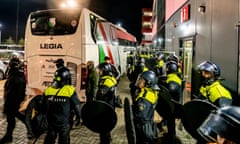 Riot police outside the Legia Warsaw bus after the game against AZ Alkmaar