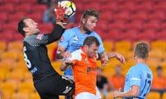 Eugene Galekovic (left) and Bart Schenkeveld of Melbourne City and Avram Papadopoulos of the Roar compete for the ball at Suncorp Stadium on Friday