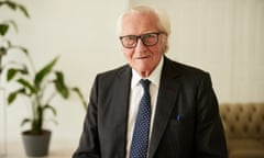 Michael Heseltine looks at the camera with a plant behind him