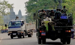 A military truck transports a resident’s belongings near Angkor Wat temple in Siem Reap province.