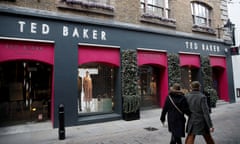 People walk past a Ted Baker store