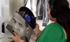 US-ENTERTAINMENT-MUSIC-LIBRARY-JAYZ<br>A woman listens to a Jay-Z record while visiting 'The Book of HOV: A celebration of the life and work of Shawn "JAY-Z" Carter' retrospective, at the Brooklyn Public Library in the Brooklyn borough of New York City on July 17, 2023. The exhibition, which will run through the Summer, features artwork, music, and memorabilia from Jay-Z's career. (Photo by ANGELA WEISS / AFP) (Photo by ANGELA WEISS/AFP via Getty Images)