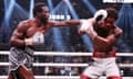 Terence Crawford, left, lands a punch on Errol Spence during their welterweight title unification fight on Saturday night in Las Vegas.