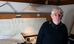 Harrison Birtwistle standing in front of his writing desk  in 2013.
