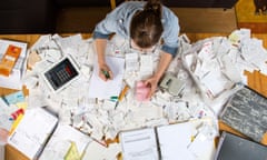 Woman with documents, records, invoices and receipts for the tax return