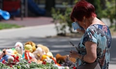 A woman cries at a makeshift memorial to the victims of a Ukrainian attack on Crimea that used US missiles.