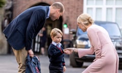 Britain’s Prince George (C) accompanied by Britain’s Prince William (L), Duke of Cambridge arrives for his first day of school at Thomas’s school in Battersea where he is met by Helen Haslem (R) head of the lower school. / AFP PHOTO / POOL / RICHARD POHLERICHARD POHLE/AFP/Getty Images