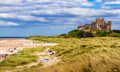 Bamburgh Castle and beach on a sunny summer's day.