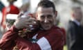 Davy Russell hugs the trophy as he celebrates after riding Tiger Roll to victory in the Grand National.