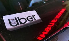 File - An Uber sign is displayed inside a car in Glenview, Ill., on Dec. 17, 2022. Ride-hailing companies Uber and Lyft will pay a combined $328 million to settle wage theft claims in New York, Attorney General Letitia James announced Thursday. (AP Photo/Nam Y. Huh, File)