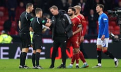 Aberdeen manager Barry Robson speaks with officials after Rangers levelled through a late penalty.