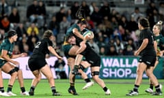 Eva Karpani of Australia is tackled by Maia Roos of New Zealand during the Pacific Four Series opener at Kayo Stadium.