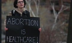 An activist holds a Pro-Choice poster