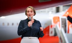 Qantas Airways chief executive Vanessa Hudson announces half-yearly earnings as she stands in front of a new Jetstar and Qantas Airbus A220 aircraft