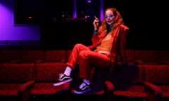 Woman sitting in cinema dressed as the joker from Batman