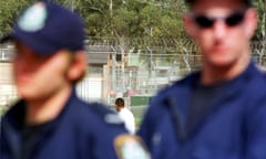 Sydney, September 23, 2001. Detainees inside the Villawood Detention Centre. More than 50 police officers surrounded a peaceful demonstration at the Villawood Detention Centre today. (AAP Image/Laura Friezer) NO ARCHIVING