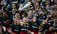 Owen Farrell, centre, and Saracens celebrate with the European Rugby Champions Cup trophy.