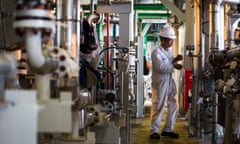 A worker at a Tullow Oil facility in Singapore