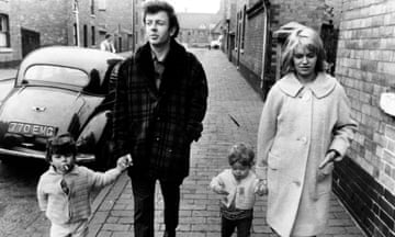 Couple with two children walk down street. Still from Cathy Come Home