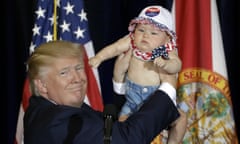 Donald Trump, Catalina Larkin<br>Republican presidential candidate Donald Trump holds up 6-month-old Catalina Larkin, of Largo, Fla., during a campaign rally Saturday, Nov. 5, 2016, in Tampa, Fla. (AP Photo/Chris O'Meara)
