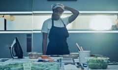 Sydney (Ayo Edebiri) looking stressed in front of a table with culinary implements in The Bear.