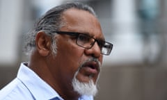 Adrian Burragubba, spokesperson for the Wangan and Jagalingou (W&J) Traditional Owners' Council, poses for photos outside the Federal Court in Brisbane, Monday, Nov. 23, 2015. W&J are challenging the decision of the National Native Title Tribunal, in an action brought by Adani, that the Queensland government may issue mining leases for Carmichael coal mine without the consent of the W&J people. (AAP Image/Dan Peled) NO ARCHIVING