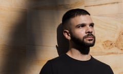 portrait of man's face against wooden paneling