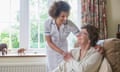 Older woman talking to caregiver in home