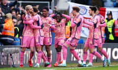 Patrick Bamford (left) is mobbed by his teammates after scoring his team's second goal against Peterborough