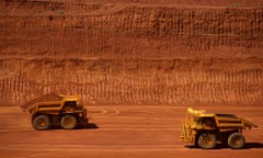 Autonomous haul trucks drive through a pit at Rio Tinto Group’s West Angelas iron ore mine in Pilbara, Australia