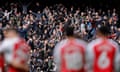 Arsenal fans celebrate after their side’s third against Spurs on 28 April 2024.