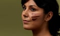 A woman with three streaks of different shade bronzers on her cheek