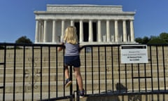 A child stands on the barricade around the Lincoln Memorial in Washington, DC, on October 2, 2013, on the second day of the federal government shutdown. US President Barack Obama on Wednesday called congressional leaders to a White House meeting, providing a glimmer of hope for movement on day two of a crippling government shutdown. The White House is squaring off with Republican rivals in Congress over how to fund federal agencies, many of which are now closed, leaving some 800,000 furloughed workers in the lurch and a fragile economy at risk. AFP Photo/Jewel SamadJEWEL SAMAD/AFP/Getty Images